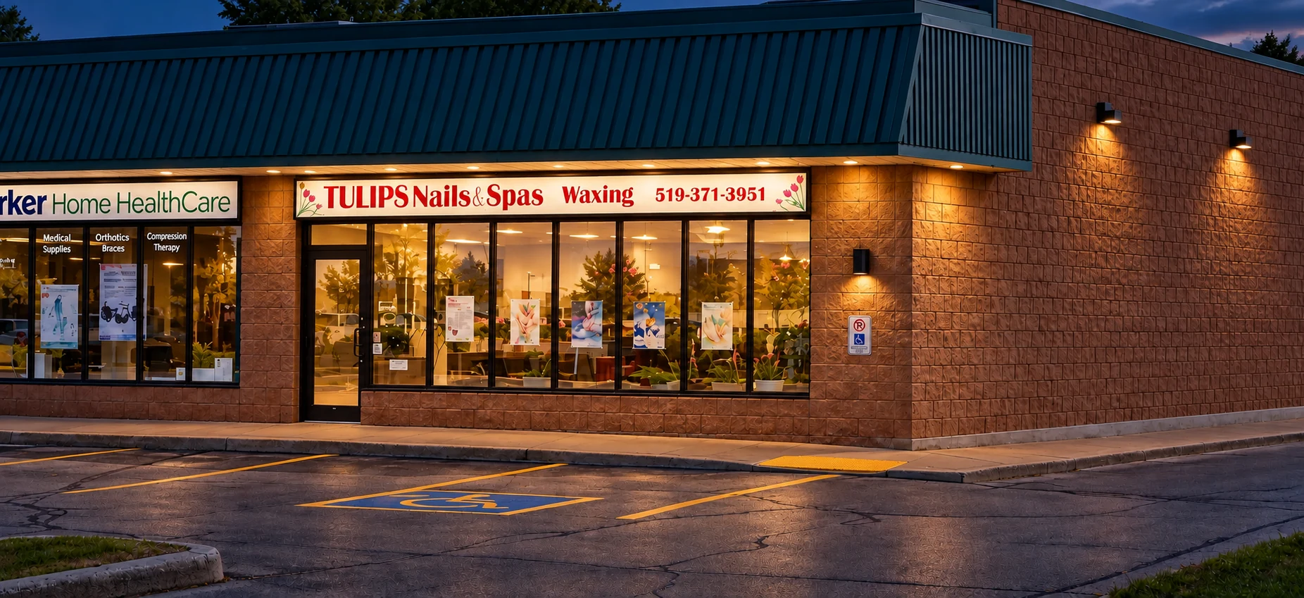 Evening view of Tulips Nails & Spa storefront in Owen Sound